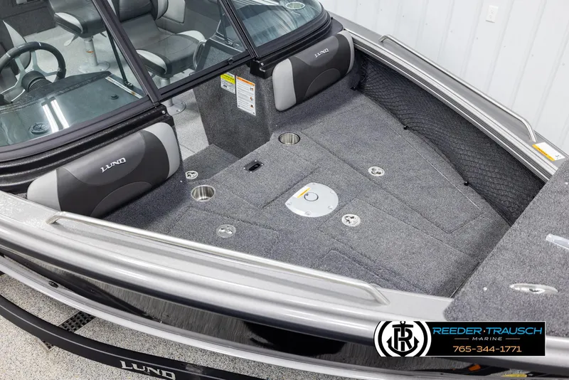 Slide: The Image of 2025 Lund 1975 Tyee boat interior with gray seating and storage compartments. - 8