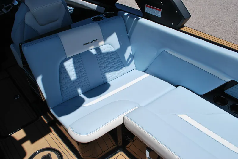 Slide: The Image of 2024 MasterCraft X26 boat interior with luxurious seating and modern design. - 10