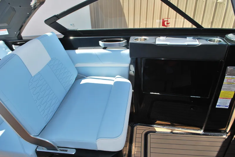 Slide: The Image of 2024 MasterCraft X26 interior with blue seating and sleek design. - 11