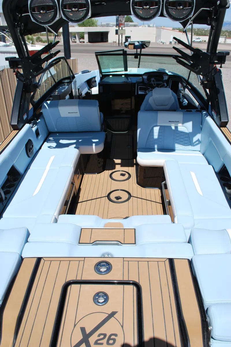 Slide: The Image of 2024 MasterCraft X26 boat interior with luxurious seating and modern design. - 15