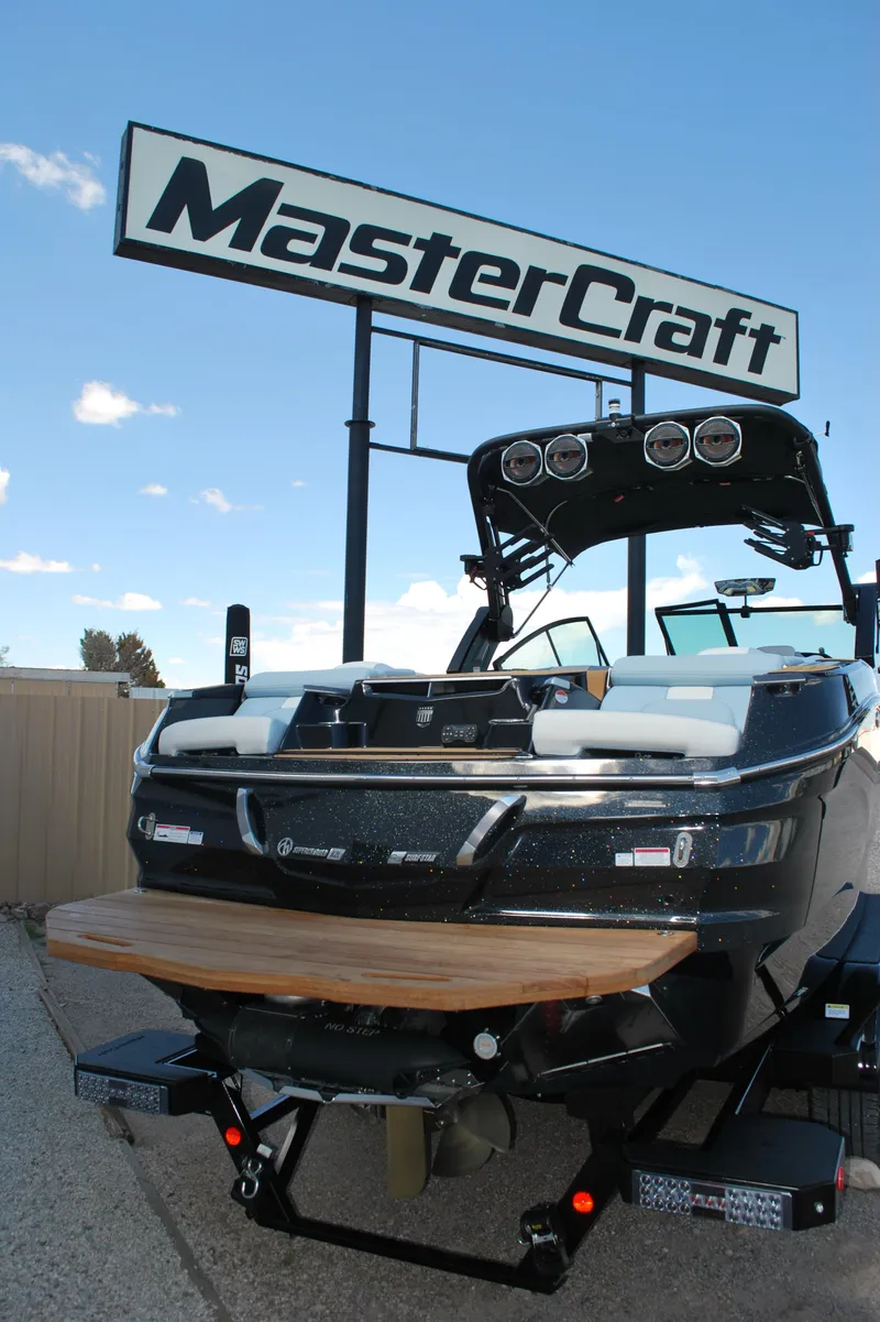 Slide: The Image of 2024 MasterCraft X26 boat displayed under MasterCraft sign. - 17