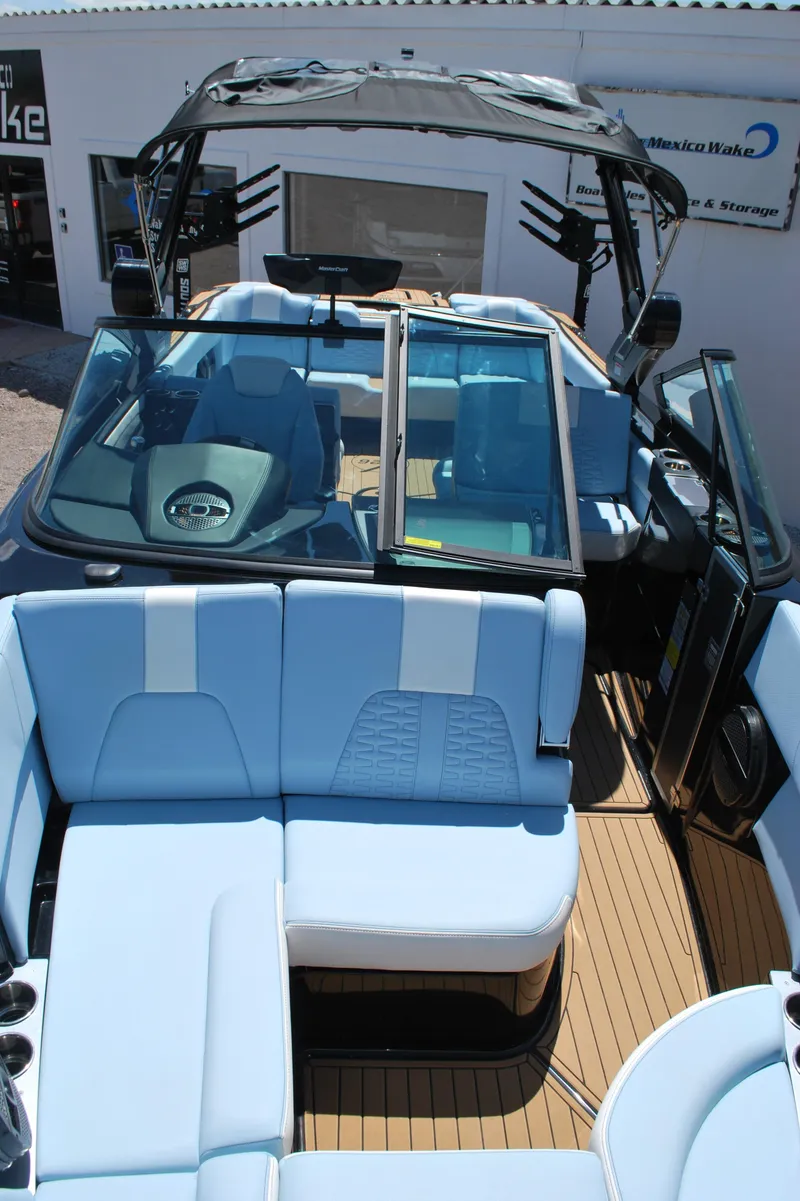 Slide: The Image of 2024 MasterCraft X26 boat with spacious seating and modern design. - 6