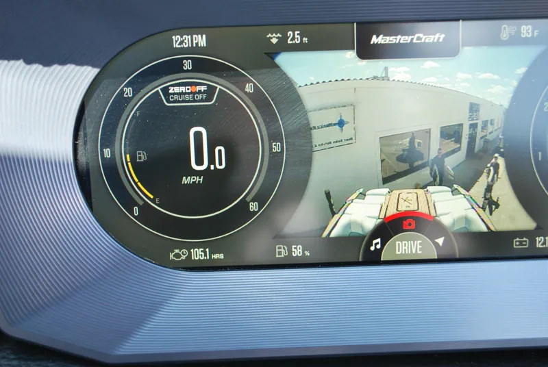 Slide: The Image of 2024 MasterCraft X26 dashboard display showing speedometer and rearview camera. - 8
