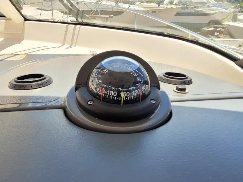 Slide: The Image of Compass on 2013 Pursuit 345 OS Offshore boat dashboard. - 16