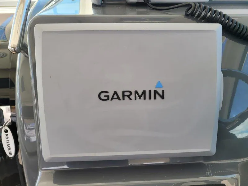 Slide: The Image of Garmin navigation system on 2013 Pursuit 345 OS Offshore boat dashboard. - 18