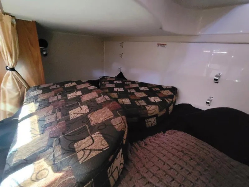 Slide: The Image of Interior cabin of 2013 Pursuit 345 OS Offshore with patterned bedding. - 33