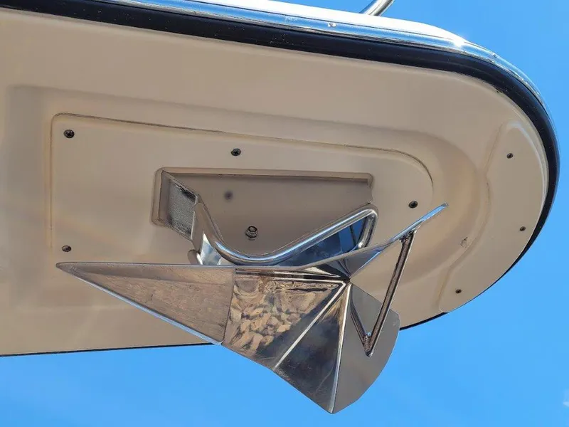 Slide: The Image of Close-up of a 2013 Pursuit 345 OS Offshore boat anchor against a clear blue sky. - 7