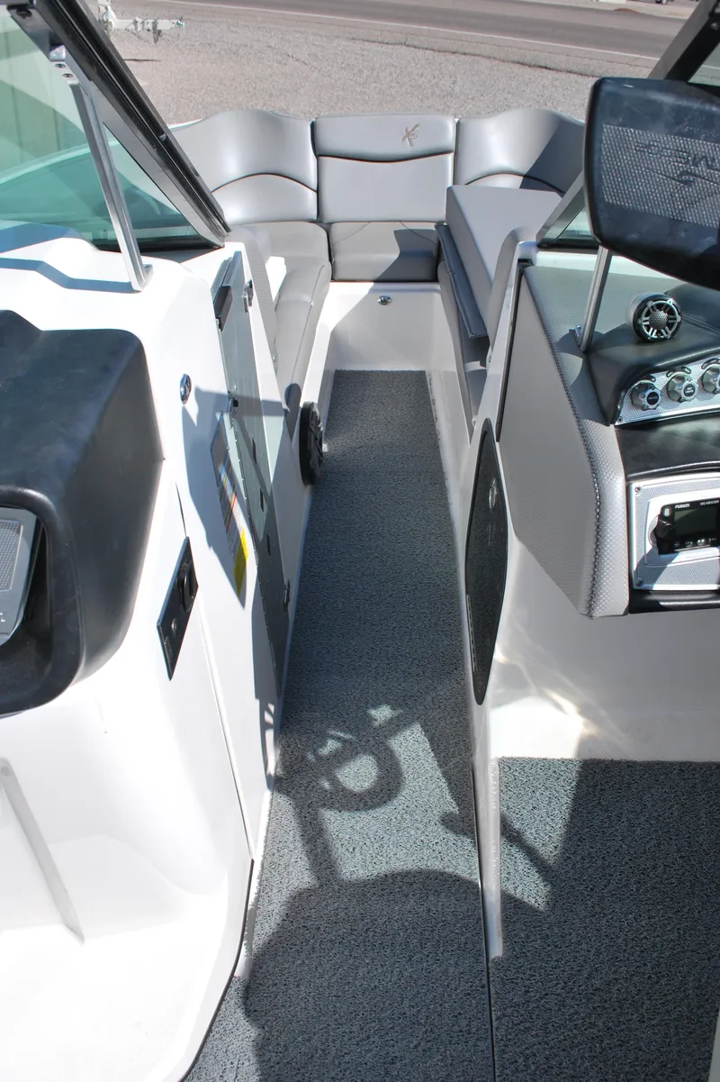 Slide: The Image of 2016 MasterCraft X26 boat interior with sleek seating and modern dashboard. - 11