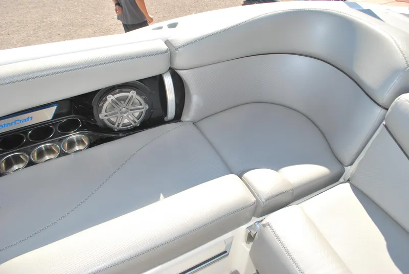Slide: The Image of 2016 MasterCraft X26 boat interior with speaker and cup holders. - 17