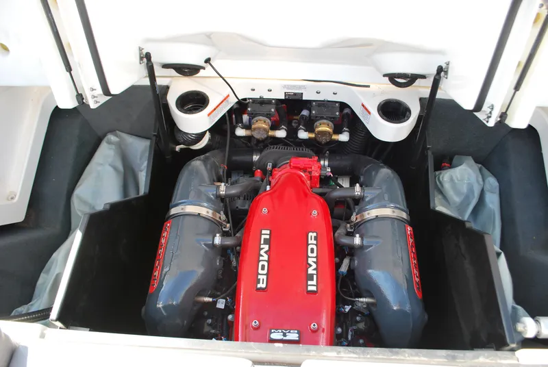 Slide: The Image of 2016 MasterCraft X26 Ilmor engine, red and black, in open compartment. - 20