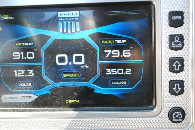 Slide: The Image of MasterCraft X26 2016 dashboard display showing air and water temperature, speed, and engine hours. - 7