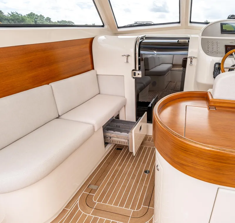Slide: The Image of Interior of 2020 Gagliotta Lobster 35 yacht with wooden accents and seating. - 11