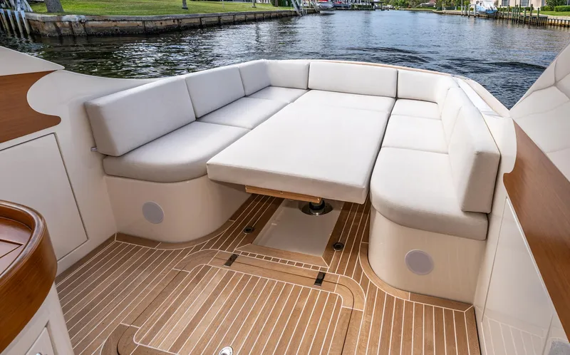 Slide: The Image of Gagliotta Lobster 35, 2020 model, featuring elegant seating and teak flooring on a serene waterway. - 15