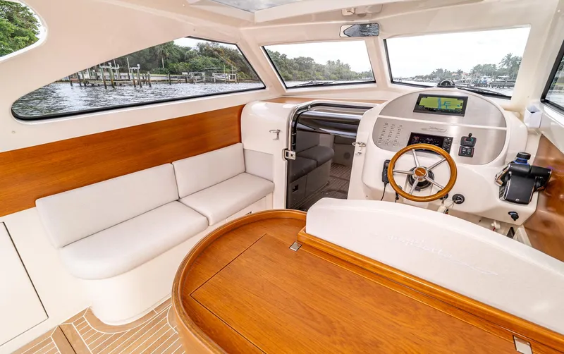 Slide: The Image of Luxurious interior of 2020 Gagliotta Lobster 35 yacht with wood accents and modern helm. - 8