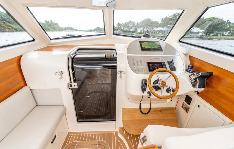 Slide: The Image of Interior of 2020 Gagliotta Lobster 35 boat with modern helm and wooden accents. - 9