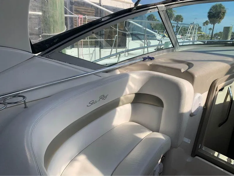 Slide: The Image of Interior of 2006 Sea Ray 320 Sundancer V-Drive boat with white seating and windshield. - 19