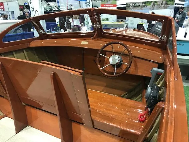 Slide: The Image of 1956 Lyman 18 Outboard boat interior with wooden steering wheel and seating. - 7