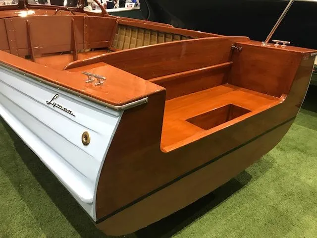 Slide: The Image of 1956 Lyman 18 Outboard boat with wooden finish and classic design. - 8