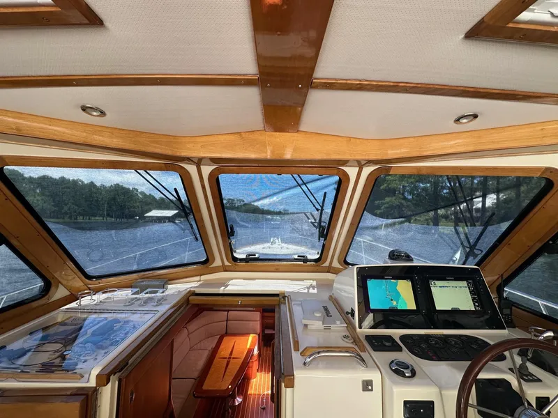Slide: The Image of Interior view of 2005 Sabre 42 Express yacht cockpit with navigation screens. - 11