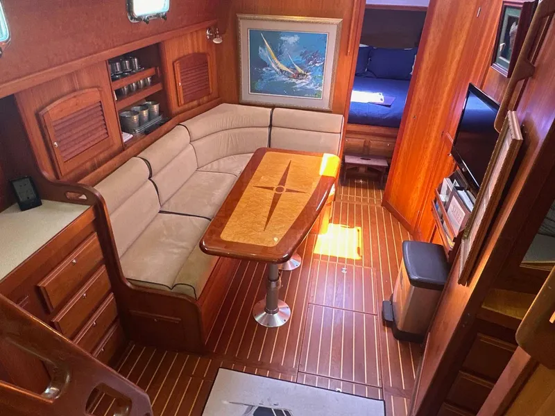 Slide: The Image of Interior of 2005 Sabre 42 Express yacht with cozy seating and elegant wood finishes. - 3