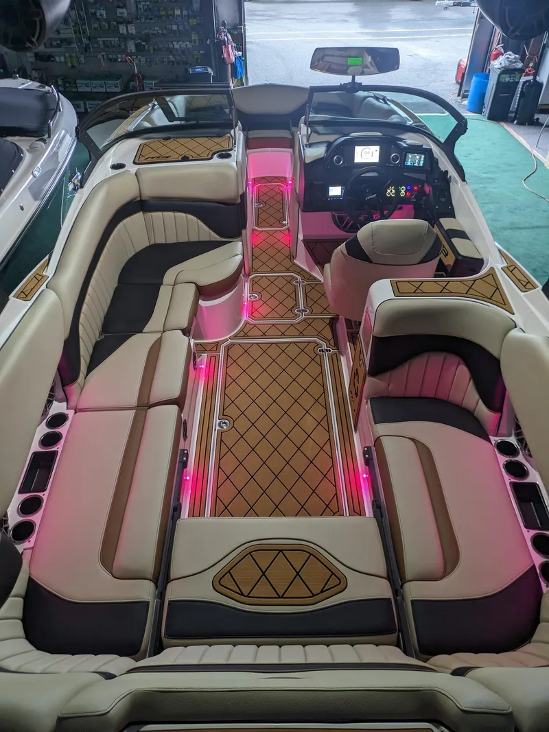 Slide: The Image of Luxurious 2025 MB B52 25 Alpha boat interior with ambient pink lighting. - 10