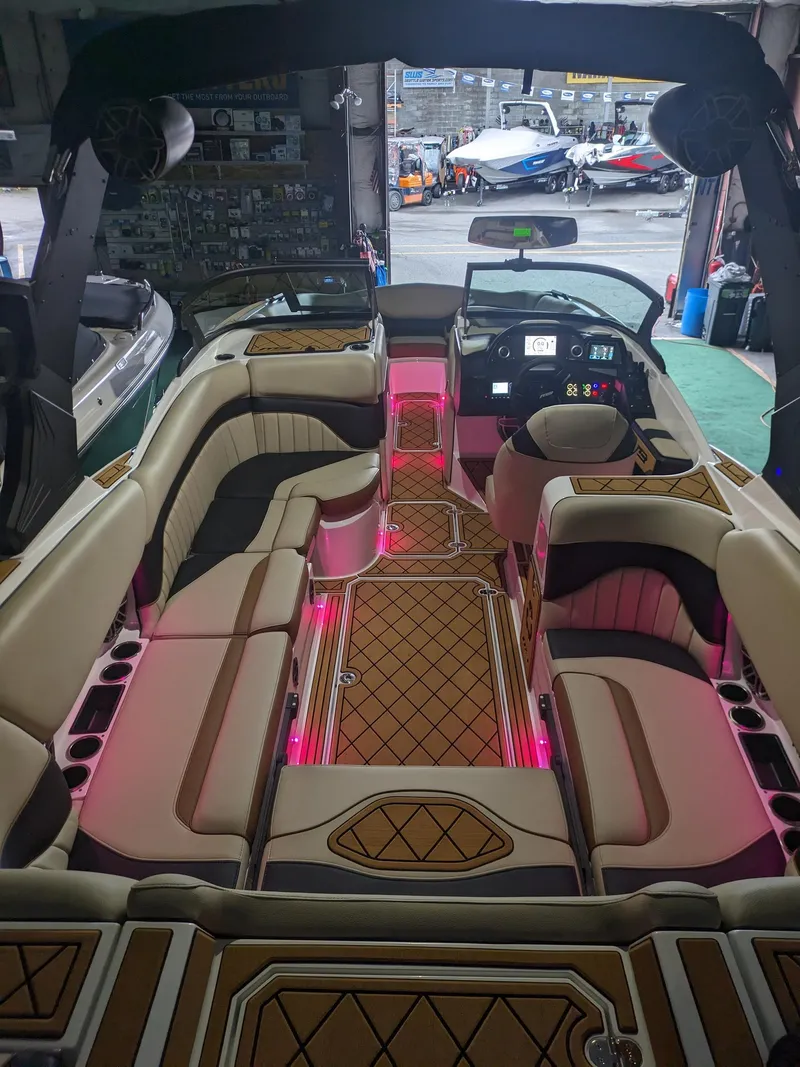 Slide: The Image of Luxurious 2025 MB B52 25 Alpha boat interior with ambient pink lighting. - 11