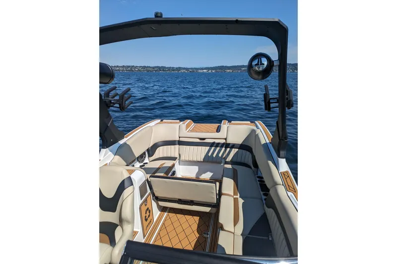 Slide: The Image of 2025 MB B52 25 Alpha boat interior with luxurious seating on a sunny day. - 15