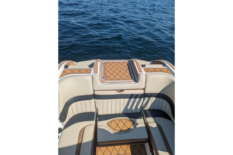 Slide: The Image of Luxury seating on 2025 MB B52 25 Alpha boat with elegant design and water backdrop. - 18