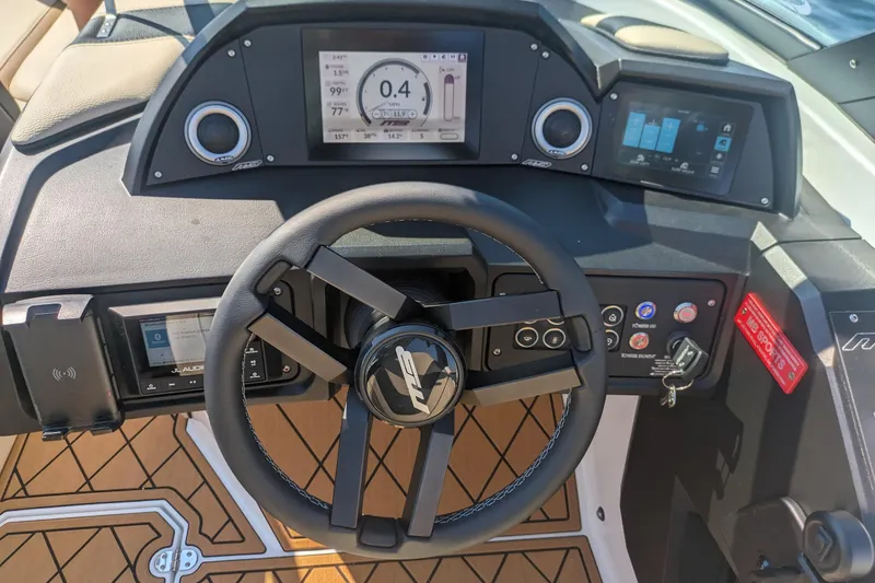 Slide: The Image of Steering wheel and dashboard of 2025 MB B52 25 Alpha boat with digital displays. - 20