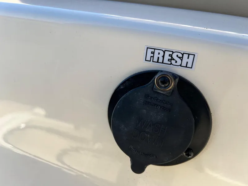 Slide: The Image of Freshwater washdown outlet on 2024 Scout 215 XSF boat. - 10