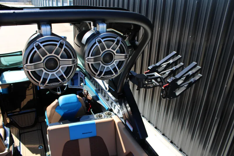 Slide: The Image of 2023 MasterCraft X26 boat with premium speakers and wakeboard racks. - 11