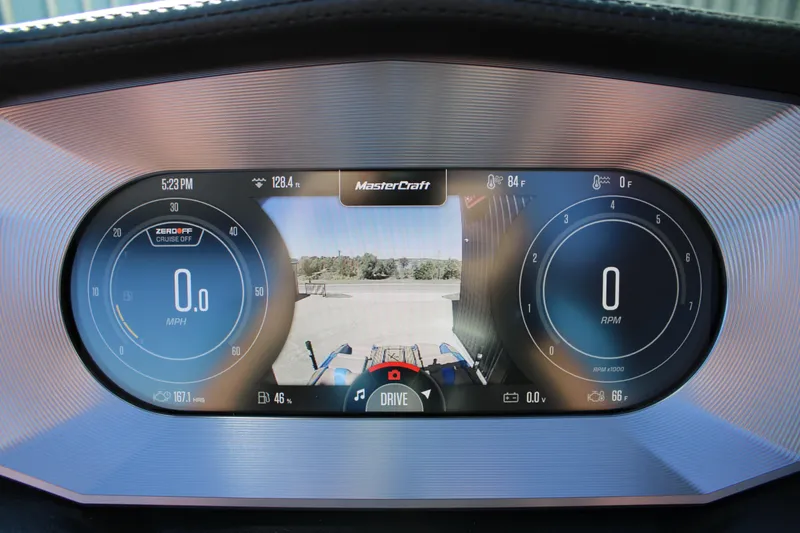 Slide: The Image of 2023 MasterCraft X26 dashboard display with speedometer, RPM, and rearview camera. - 22