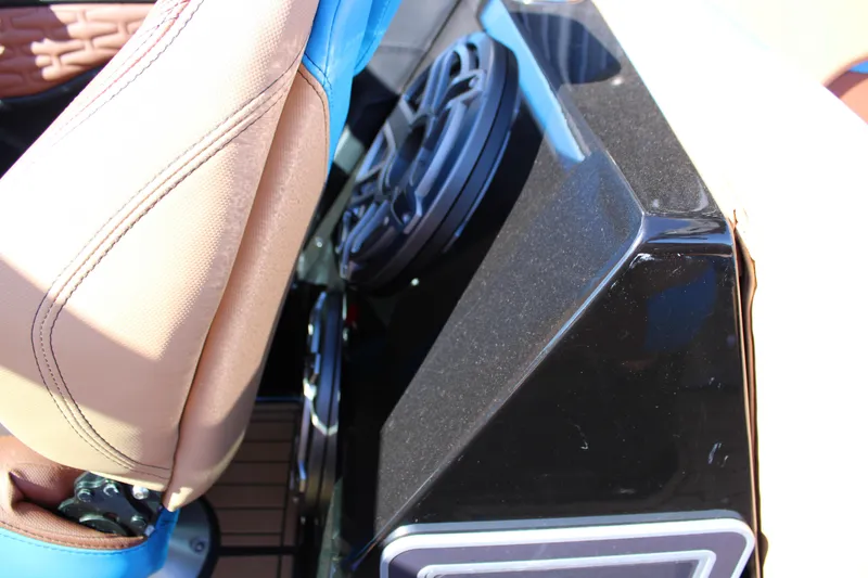 Slide: The Image of 2023 MasterCraft X26 interior detail with speaker and seat stitching. - 23