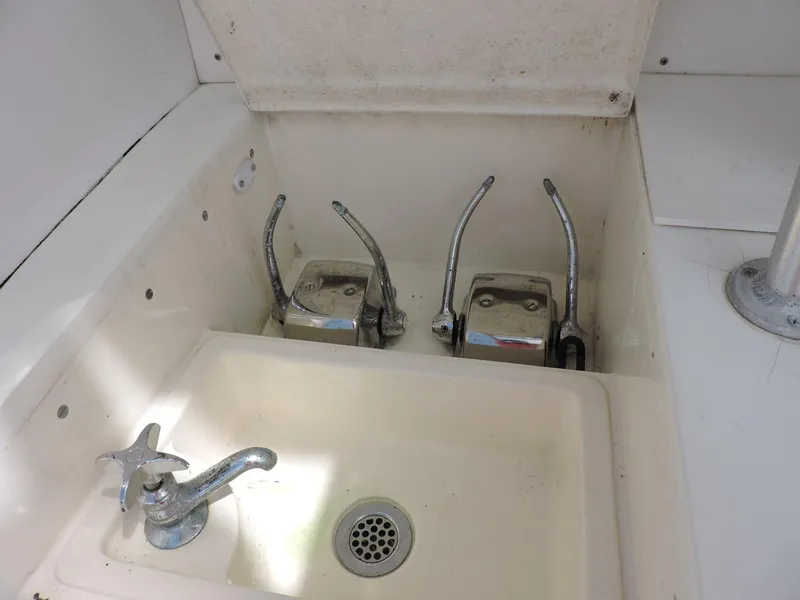 Slide: The Image of Boat sink with dual levers, chrome faucet, and drain, Post 44 model, 1990. - 12