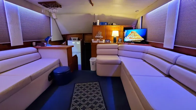 Slide: The Image of Luxurious 1990 Post 44 yacht interior with plush seating and ambient lighting. - 21