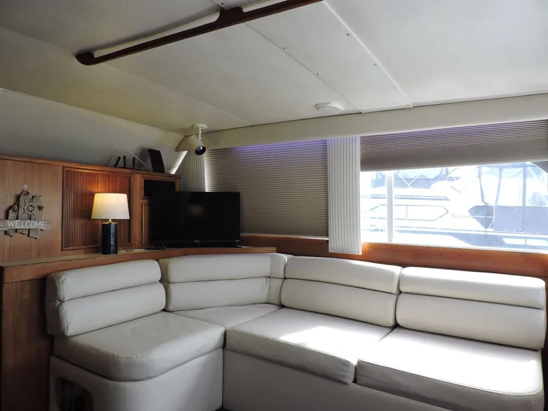 Slide: The Image of Luxurious 1990 Post 44 yacht interior with white leather seating and modern decor. - 23