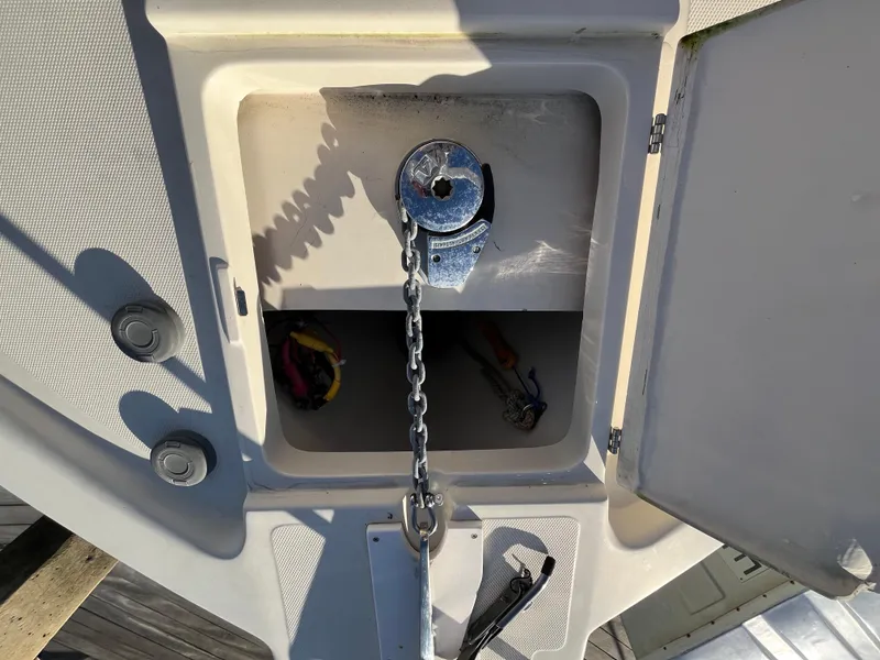 Slide: The Image of Anchor chain compartment on a 2005 Mainship RumRunner boat. - 18