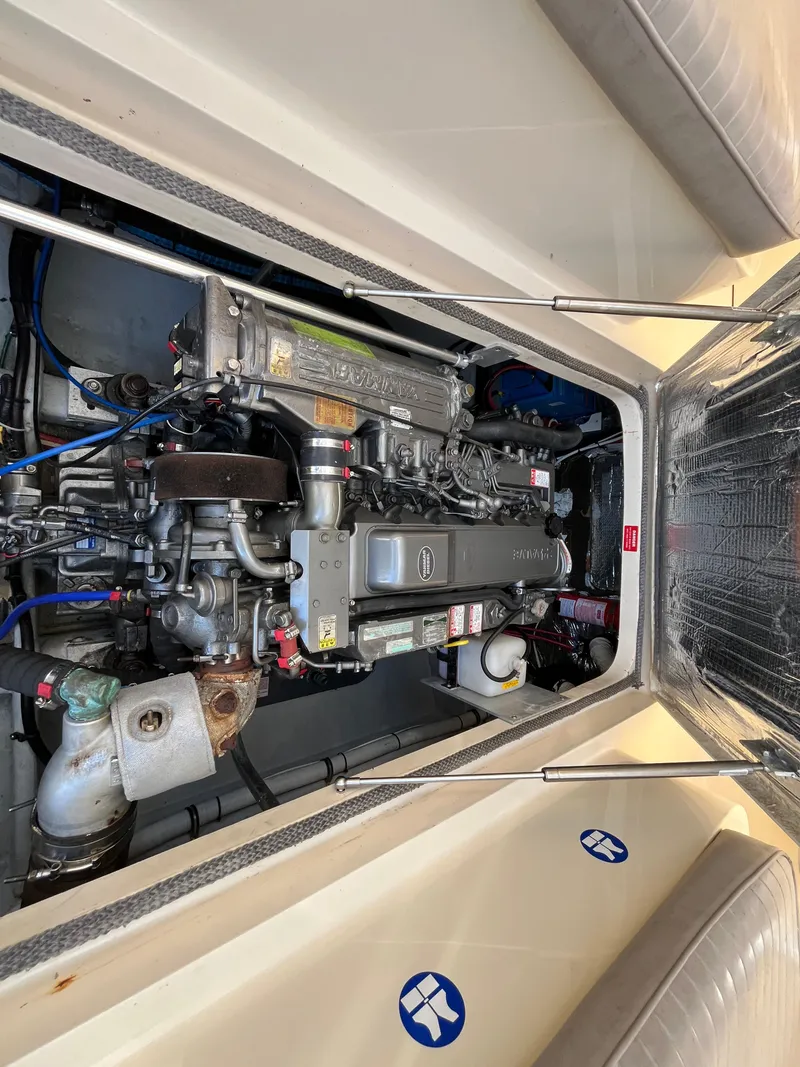 Slide: The Image of 2005 Mainship RumRunner engine compartment, showcasing detailed mechanical components. - 37