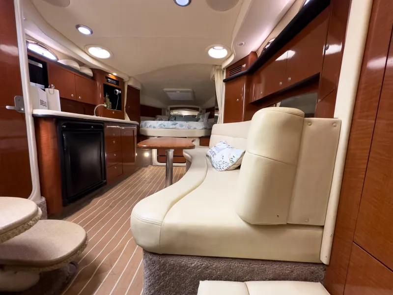 Slide: The Image of Luxurious interior of 2005 Sea Ray 340 Sundancer yacht with plush seating and modern amenities. - 13