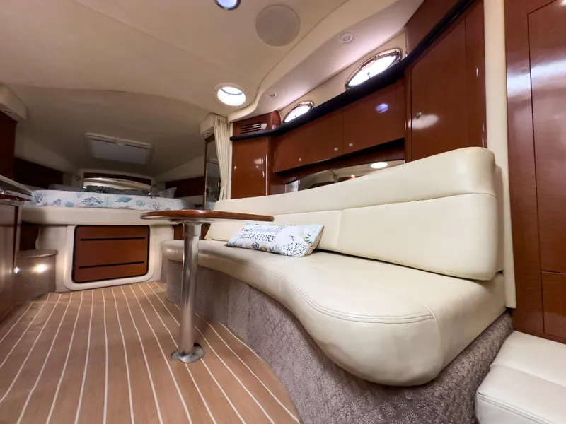 Slide: The Image of Luxurious interior of 2005 Sea Ray 340 Sundancer yacht with plush seating and elegant wood finishes. - 14