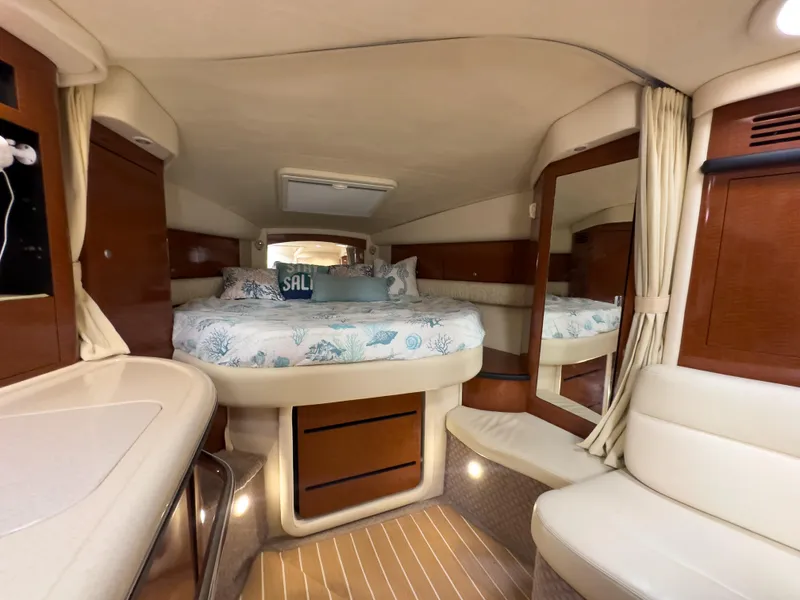 Slide: The Image of Luxurious interior of 2005 Sea Ray 340 Sundancer yacht with cozy bed and elegant wood finish. - 18