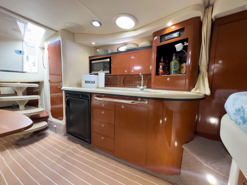 Slide: The Image of Luxurious 2005 Sea Ray 340 Sundancer yacht interior with modern kitchen amenities. - 20