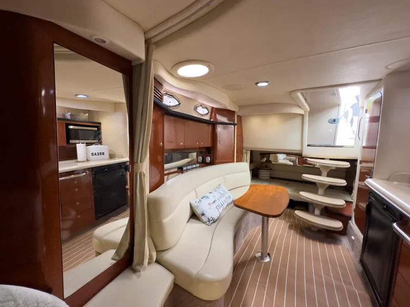 Slide: The Image of Luxurious interior of 2005 Sea Ray 340 Sundancer yacht with elegant seating and modern amenities. - 22