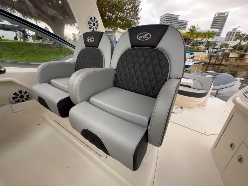 Slide: The Image of Luxury seating on 2005 Sea Ray 340 Sundancer boat, featuring sleek design and waterfront view. - 28