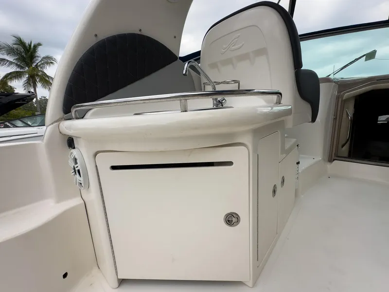 Slide: The Image of 2005 Sea Ray 340 Sundancer boat interior with sink and storage area. - 29