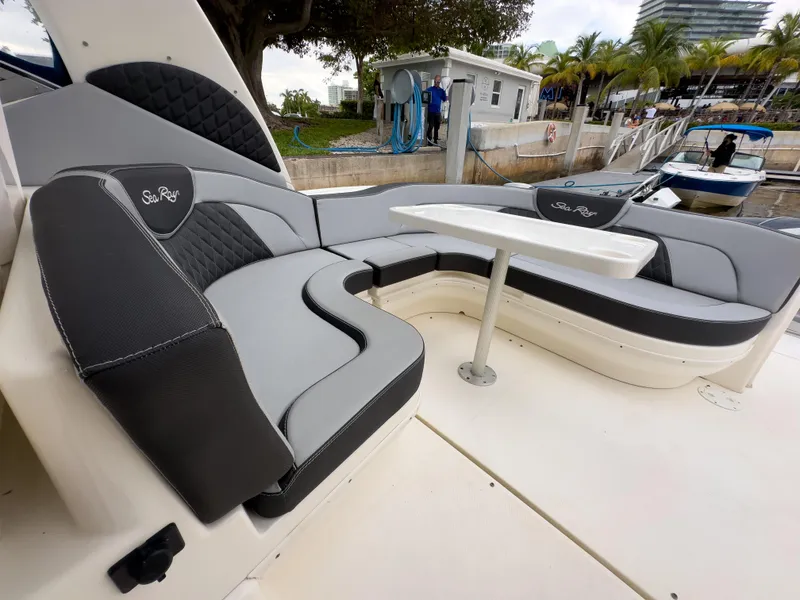 Slide: The Image of 2005 Sea Ray 340 Sundancer boat with stylish seating and table at marina. - 31