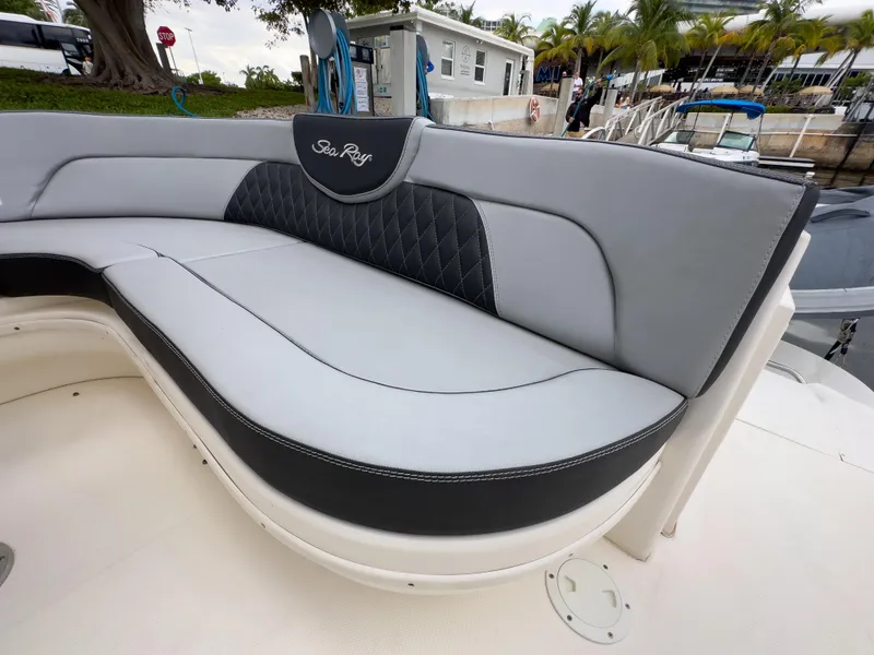 Slide: The Image of 2005 Sea Ray 340 Sundancer boat seating with elegant gray and black upholstery. - 33