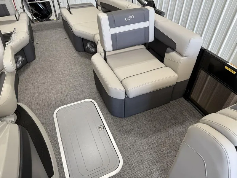 Slide: The Image of 2025 Barletta C22M boat interior with gray seating and carpeted flooring. - 11