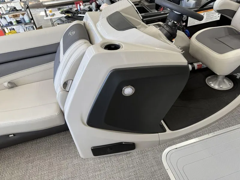 Slide: The Image of 2025 Barletta C22M boat interior with modern seating and steering console. - 12