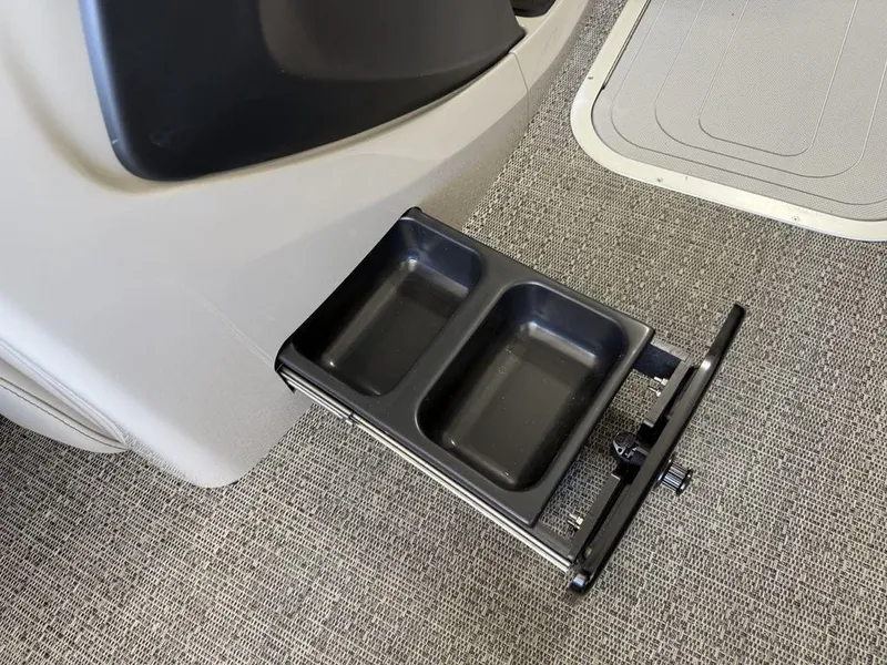 Slide: The Image of Barletta C22M 2025 boat with dual cup holder on carpeted floor. - 14